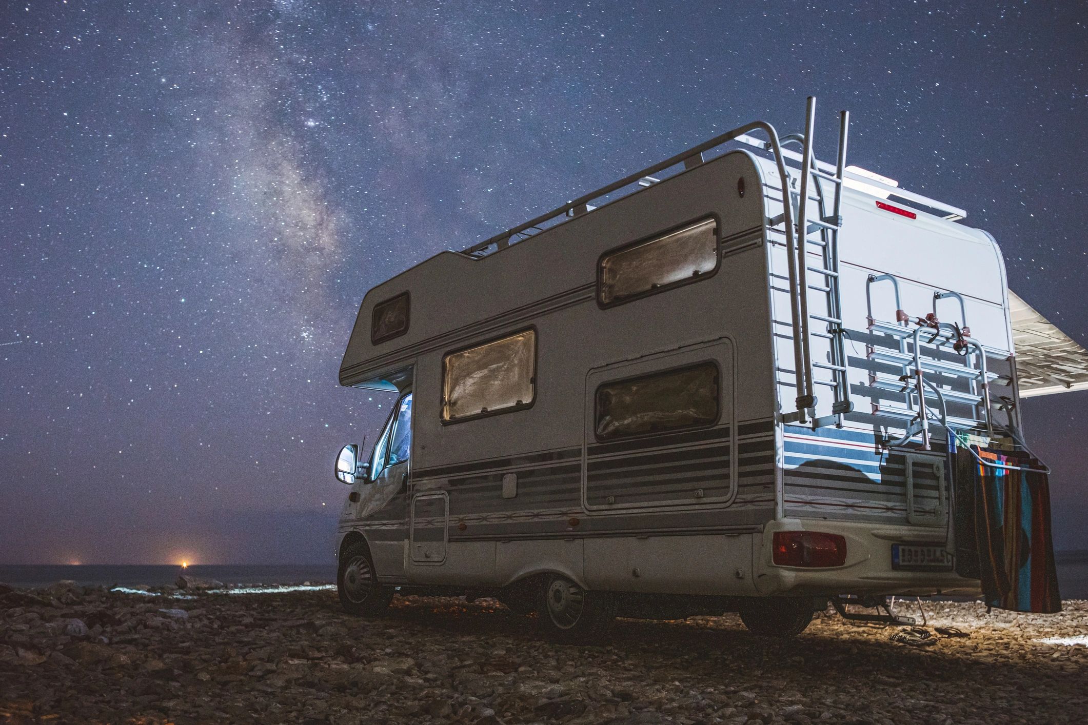Motorhome parked near a resort road at golden hour